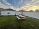 Backyard with picnic table and grassy area at 4702 Greycliff Prairie Dr, Kissimmee, FL 34758