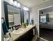 Bathroom with double vanity and view of bedroom at 4702 Greycliff Prairie Dr, Kissimmee, FL 34758