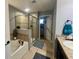 Spa-like bathroom with a soaking tub and walk-in shower at 4702 Greycliff Prairie Dr, Kissimmee, FL 34758