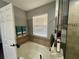 Main bathroom with soaking tub and walk-in shower at 4702 Greycliff Prairie Dr, Kissimmee, FL 34758