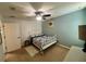Bright bedroom with a ceiling fan and a comfortable bed at 4702 Greycliff Prairie Dr, Kissimmee, FL 34758