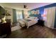 Main bedroom with large bed, stylish decor, and ceiling fan at 4702 Greycliff Prairie Dr, Kissimmee, FL 34758