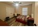 Bedroom with a queen-size bed and home office at 4702 Greycliff Prairie Dr, Kissimmee, FL 34758