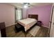 Bedroom with wood-look flooring, light walls and ceiling fan at 4702 Greycliff Prairie Dr, Kissimmee, FL 34758