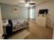 Bedroom with a queen-size bed and dresser at 4702 Greycliff Prairie Dr, Kissimmee, FL 34758