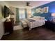 Main bedroom with king bed and stylish decor at 4702 Greycliff Prairie Dr, Kissimmee, FL 34758