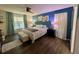 Main bedroom with a king-size bed and a view of the backyard at 4702 Greycliff Prairie Dr, Kissimmee, FL 34758