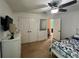 Bedroom with double doors leading to a bathroom and large closet at 4702 Greycliff Prairie Dr, Kissimmee, FL 34758