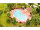 Resort-style pool with adjacent clubhouse at 4702 Greycliff Prairie Dr, Kissimmee, FL 34758