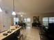Kitchen and dining area with access to patio at 4702 Greycliff Prairie Dr, Kissimmee, FL 34758