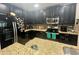 Modern kitchen with granite countertops and stainless steel appliances at 4702 Greycliff Prairie Dr, Kissimmee, FL 34758