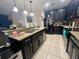 Modern kitchen with island and breakfast bar at 4702 Greycliff Prairie Dr, Kissimmee, FL 34758