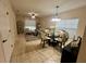 Living and dining area with ample natural light at 4702 Greycliff Prairie Dr, Kissimmee, FL 34758