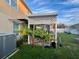 White wooden pergola with lattice top, next to AC unit and plants at 4702 Greycliff Prairie Dr, Kissimmee, FL 34758