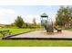 Community playground with playset and benches at 4702 Greycliff Prairie Dr, Kissimmee, FL 34758
