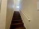 Dark wood staircase leads to the upper level at 4702 Greycliff Prairie Dr, Kissimmee, FL 34758