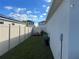 Small backyard with a wooden fence and a lawn at 503 Summer Grove Ln, Haines City, FL 33844