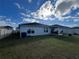 Large backyard with grassy area and patio at 503 Summer Grove Ln, Haines City, FL 33844