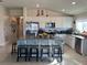 Spacious kitchen with granite countertops, white cabinets, and an island at 503 Summer Grove Ln, Haines City, FL 33844