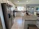 Kitchen with granite countertops, white cabinets, stainless steel appliances, and an island at 503 Summer Grove Ln, Haines City, FL 33844