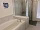 Bathroom with shower and bathtub at 5465 Misty Oak Cir, Davenport, FL 33837
