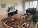 Bright dining area with large table and seating for six at 5465 Misty Oak Cir, Davenport, FL 33837