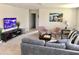 Spacious game room with comfortable seating and large TV at 5465 Misty Oak Cir, Davenport, FL 33837