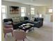 Spacious game room with sectional sofa and coffee table at 5465 Misty Oak Cir, Davenport, FL 33837