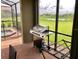 Screened patio with built-in grill and pool view at 5465 Misty Oak Cir, Davenport, FL 33837