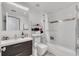 Clean bathroom with a bathtub, toilet and modern vanity at 600 Market St # 210, Celebration, FL 34747