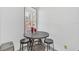 Small breakfast nook with round table and three stools at 600 Market St # 210, Celebration, FL 34747