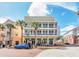 Three-story building with balconies and ground floor retail at 600 Market St # 210, Celebration, FL 34747