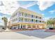 Three-story building with balconies and ground floor retail at 600 Market St # 210, Celebration, FL 34747