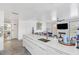 Modern white kitchen with quartz countertops and island at 600 Market St # 210, Celebration, FL 34747