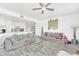 Open concept living room with kitchen and seating area at 600 Market St # 210, Celebration, FL 34747