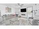 Bright living room featuring a large TV and comfy seating at 600 Market St # 210, Celebration, FL 34747