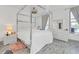 Elegant main bedroom with a four poster bed and dresser at 600 Market St # 210, Celebration, FL 34747