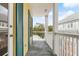 Private balcony overlooks treetops and neighboring buildings at 600 Market St # 340, Celebration, FL 34747