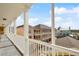 Balcony view showcases the neighborhood's colorful architecture and sunny skies at 600 Market St # 340, Celebration, FL 34747