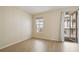 Bedroom featuring wood floors, a window, and a private balcony at 600 Market St # 340, Celebration, FL 34747