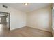 Large bedroom with wood floors and access to another room at 600 Market St # 340, Celebration, FL 34747