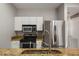 Stainless steel appliances and granite countertops in this updated kitchen at 600 Market St # 340, Celebration, FL 34747