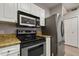 Modern kitchen with stainless steel appliances and granite countertops at 600 Market St # 340, Celebration, FL 34747