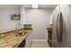 Kitchen featuring a stainless steel fridge, granite countertops, and stainless steel sink at 600 Market St # 340, Celebration, FL 34747