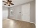 Bright living room with wood floors, a ceiling fan and a window overlooking the community at 600 Market St # 340, Celebration, FL 34747