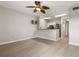 Bright living space with wood floors and a view of the kitchen at 600 Market St # 340, Celebration, FL 34747