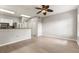 Living space with wood floors, bright lighting, and a view of the kitchen at 600 Market St # 340, Celebration, FL 34747