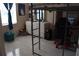 A tidy bedroom with a loft bed, desk, and neutral-colored furniture at 6002 Renaissance Ct, St Cloud, FL 34772