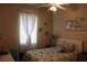 A well-lit bedroom featuring a comfortable bed, soft textures, and decorative wall art at 6002 Renaissance Ct, St Cloud, FL 34772