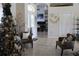 Inviting foyer with a decorated entrance, stylish seating, and views into other rooms at 6002 Renaissance Ct, St Cloud, FL 34772